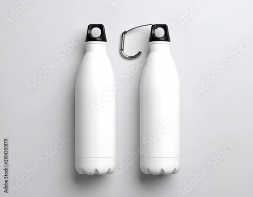 Two white insulated water bottles, one with a carabiner clip, sit on a light gray surface