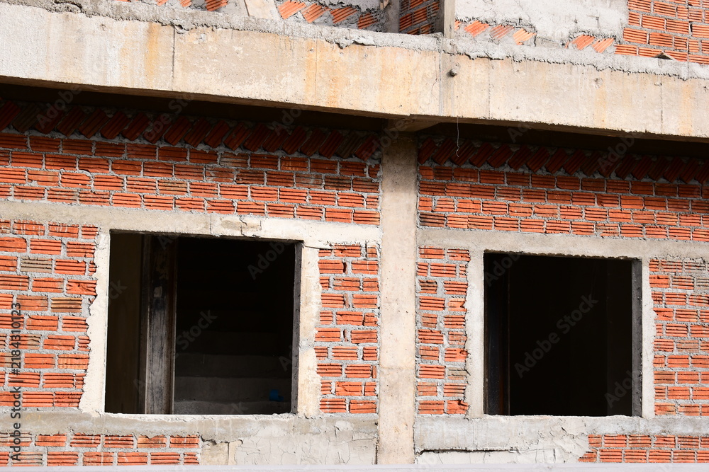 Obraz premium exterior view of brick house under construction with concrete structure