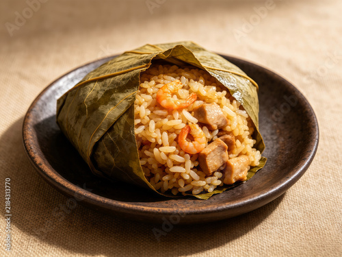 Lotus leaf wrapped glutinous rice with shrimp and pork, Cantonese dim sum dish