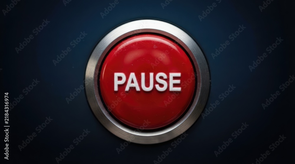 Fototapeta premium Close up of a red pause button on a metallic control panel with sits metallic surface button white text equipment control device control user interface