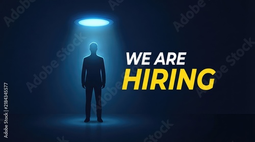 Professional figure standing under bright spotlight with hiring announcement text with Silhouetted person formal attire stands beneath glowing circular light hiring text