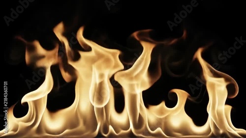 Fiery Fireplace Flame Forming Glowing Golden Background with Curling Firelight, Warm Illumination, Rising Blaze, Elegant Shapes, and Dramatic Cozy Atmosphere Against Deep Black Darkness