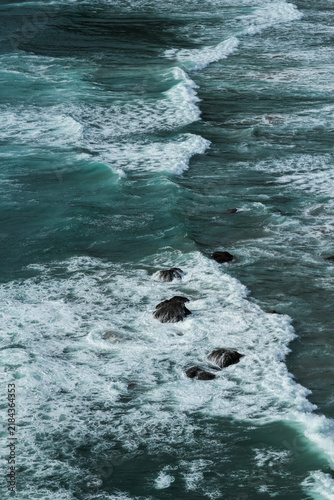 Принти на полотні Turquoise Ocean Waves and Rocky Coastline from Above