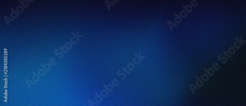 Deep blue grain texture background with soft light gradient transitions ideal for professional presentation slides and moody minimalist wallpaper designs.