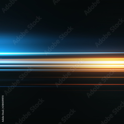 Dynamic abstract light trails in blue and orange on a dark background.
