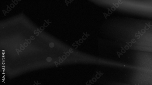 Abstract dark grayscale background with blurry geometric shapes and soft light effects
