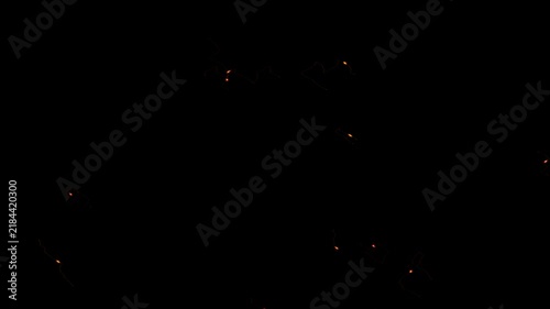 Dynamic Glowing Orange Sparks and Embers on Black Background