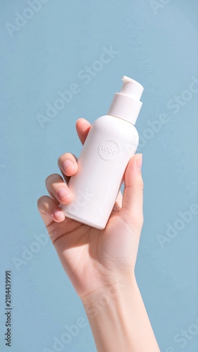 hand holding a bottle