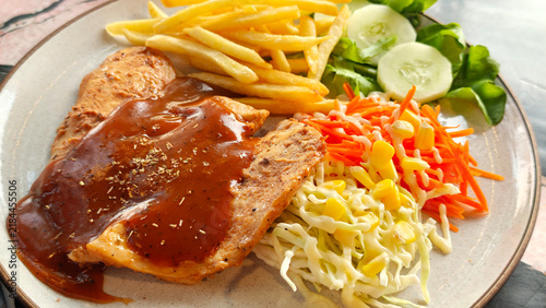 Foto Chicken steak and french fries