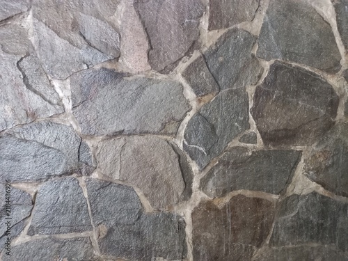 Картината върху платно Natural Stone Wall Texture Background with Irregular Cut Stones