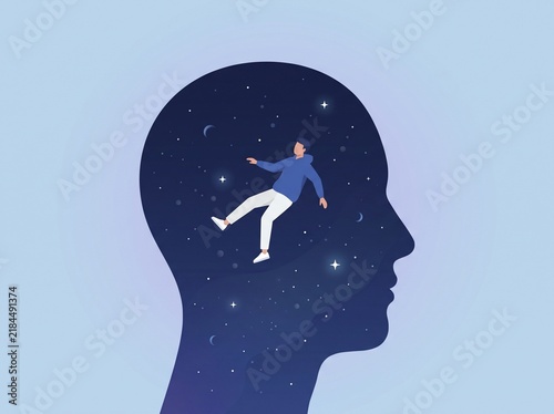 Person floating inside a human head silhouette with galaxy