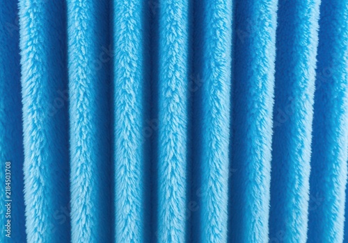 Bright blue plush fabric with vertical folds and soft texture textile