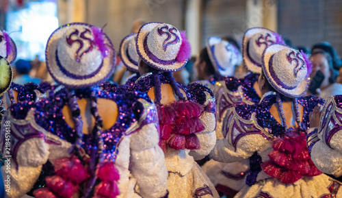 Close Up Details of Dancers in Colorful Traditional Costumes and Masks at a Peruvian Folk Dance Festival Parade