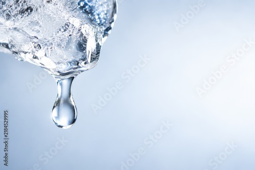 Melting Ice with Clear Water Droplet and Copy Space