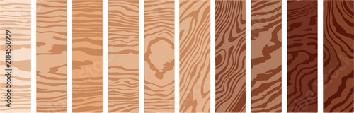 Variety of Wood Grain Patterns: A collection of vertical wood planks showcasing a spectrum of grain patterns and color tones, from pale blonde to deep mahogany.