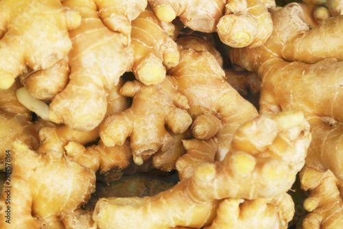 Fresh ginger roots as background	