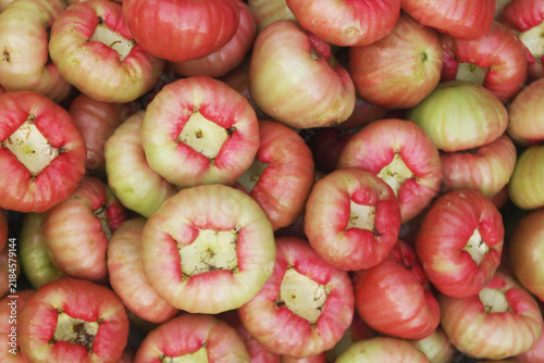 Many fresh ripe rose apple fruits as background	
