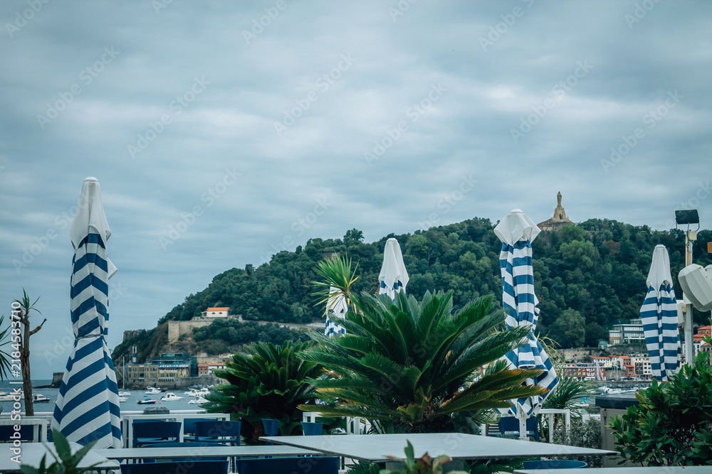 Obraz premium outdoor restaurant overlooking La Concha Bay in San Sebastian, Basque Country, Spain