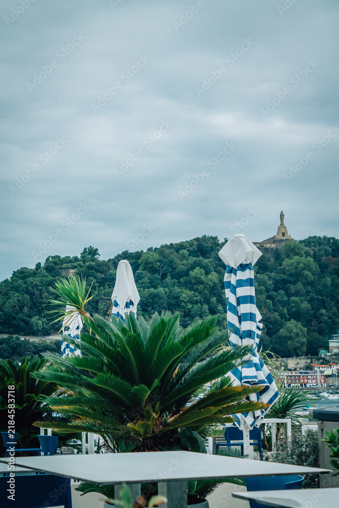 Obraz premium outdoor restaurant overlooking La Concha Bay in San Sebastian, Basque Country, Spain