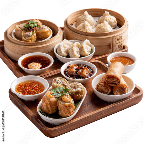 Dim sum assortment with spring rolls served in  at local eatery during lunchtime