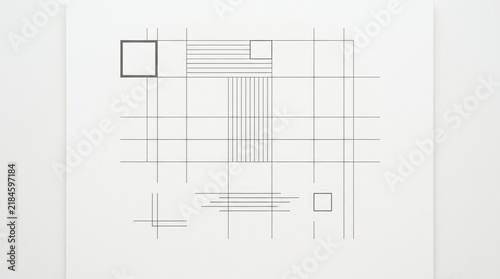 Minimalist geometric grid drawing with squares and lines on white background.