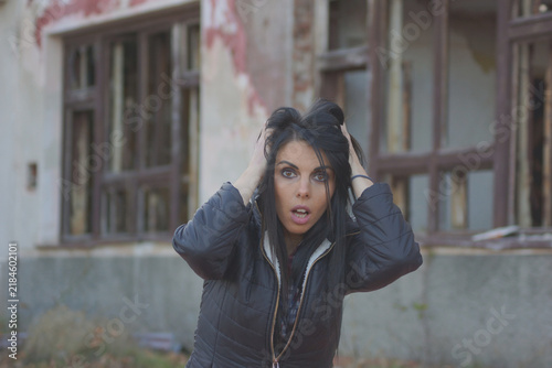 Hysterical, depressed woman holding her head
