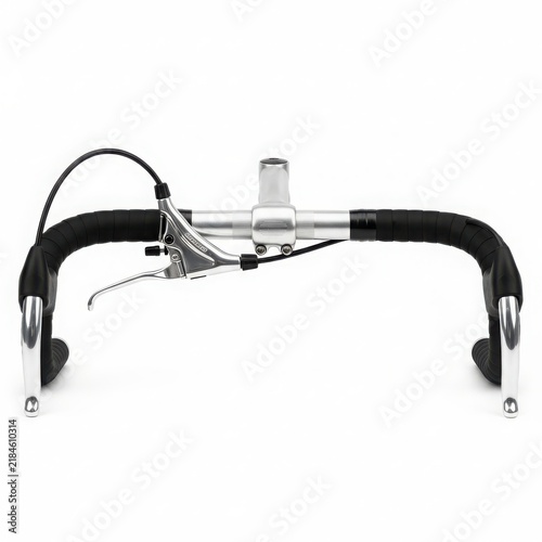 Bike handlebar with brake and gear levers isolated on white background