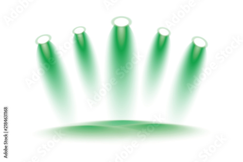 Green theatrical spotlights arranged in a row and illuminating the central stage with powerful glowing beams