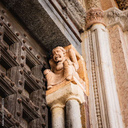 Картината върху платно Grotesque stone carving adorning an ancient Lodi Duomo door