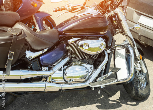 Obraz na płótnie Modern cruiser motorcycle with gleaming chrome exhaust pipes, engine components,