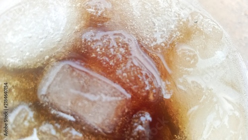 Close up macro shot of sweet ice dessert with coconut milk and liquid brown sugar