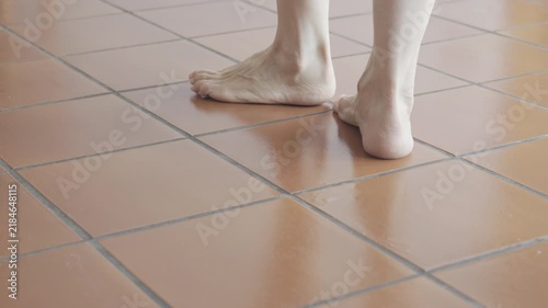 Detail of walking  barefoot on thefloor