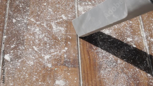 Using  vacuum cleaner on wooden floor