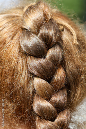 Fotografie Close-up of a neatly braided hairstyle