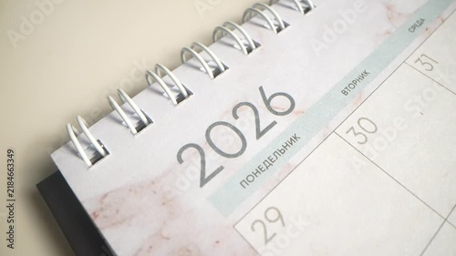 Hand, writing and calendar for schedule, planning and organization with timeline for tasks or event. Priority, agenda and goals with person for productivity, time management and reminder for deadline