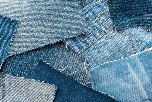 Texture from torn pieces of denim. Jeans texture. Material for sewing clothes