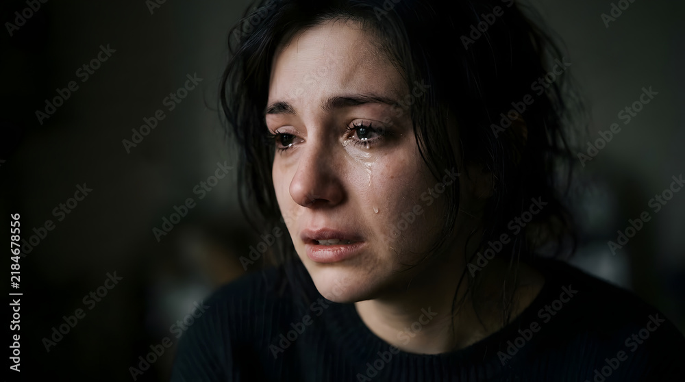 Fototapeta premium Crying sad young woman portrait
