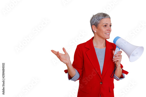 Fotografía Mature woman in red blazer holding megaphone making announcement, communicating