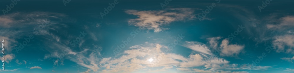 Fototapeta premium Sky clouds panorama showing a 360 degree view of a bright blue atmosphere with wispy white cirrus clouds during daytime