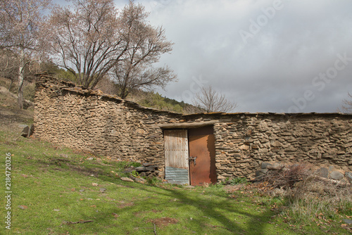 Photography abandoned stone country house; rural depopulation