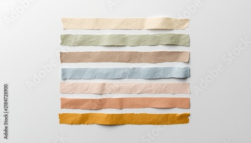 Collection of colorful torn paper tape strips isolated on white