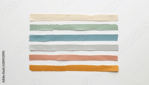 Collection of colorful torn paper tape strips isolated on white
