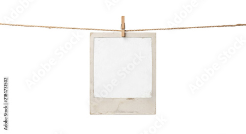 Fotografie Vintage instant photo frame hanging on a twine line with a wooden clothespin
