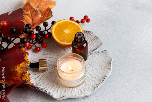фотографія Aroma lamp with autumn wax melts and decorative elements on a surface