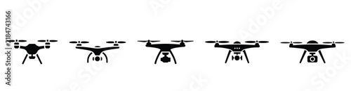 Set of black silhouette icons of flying drones with cameras on white background