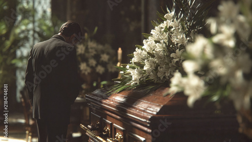 man crying over a coffin, funeral home websites, grief support organizations, memorial service brochures, bereavement counseling articles, editorial publications about loss, hospice care resources