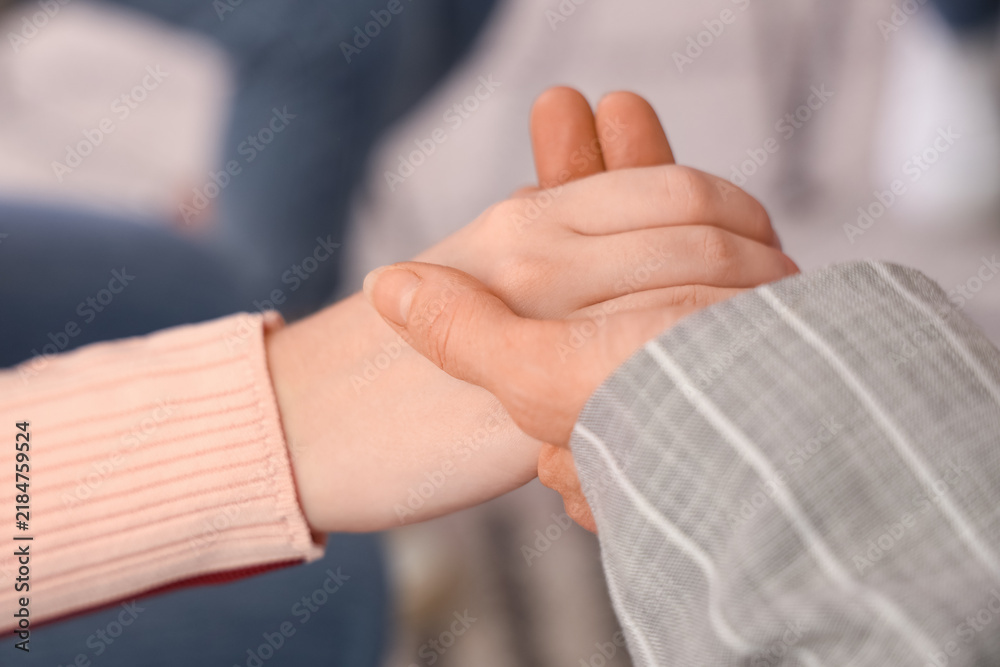 Fototapeta premium People holding hands at group therapy session, closeup