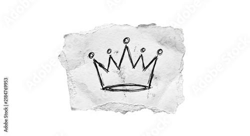 Foto Hand drawn crown sketch on torn paper, a symbol of royalty and power