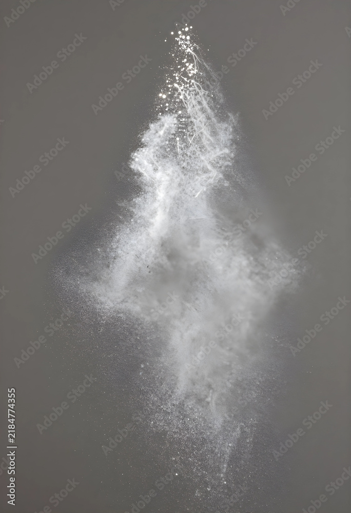 Obraz premium Explosion and motion concept white powder particles scattering in the air abstract energy and transformation dust cloud on a dark grey background