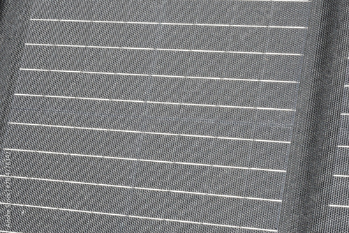 фотографія Macro detailed view of a flexible solar panel surface showing the fine weave fab